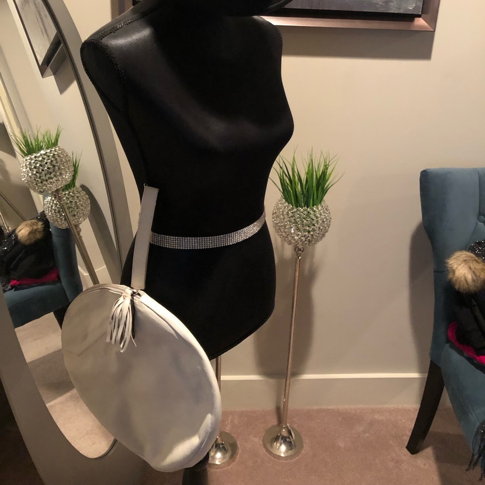 New full size white leather round wristlet handbag.